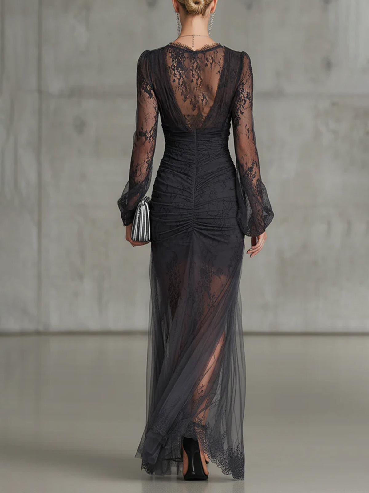 Elegant black long dress by Bennett and Family with a fitted silhouette and classic round neckline, shown on a model.