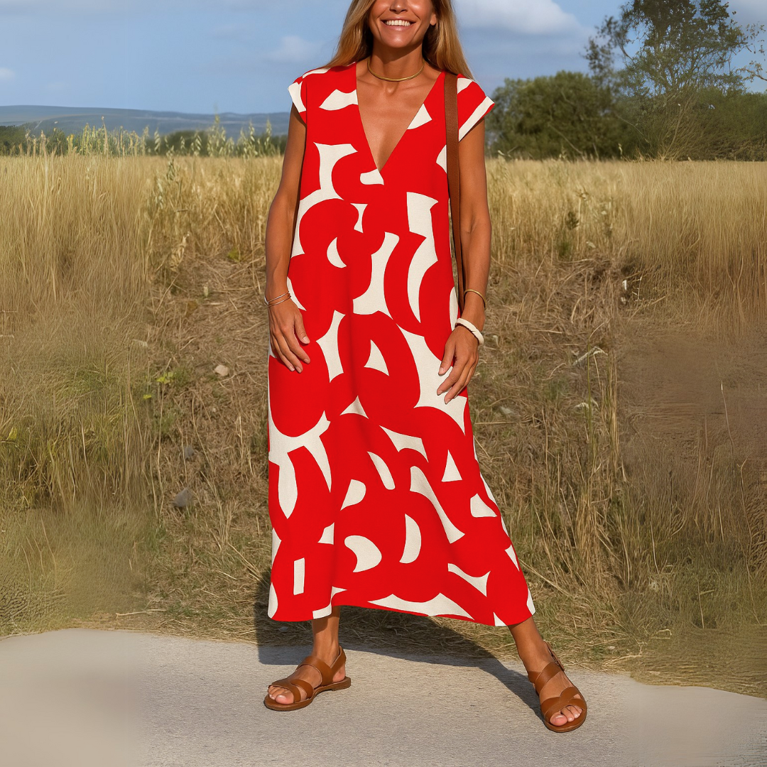 Lightweight Valérie V-Neck Dress by The Rowan Daughters displayed on a hanger, showcasing its soft fabric and classic silhouette.