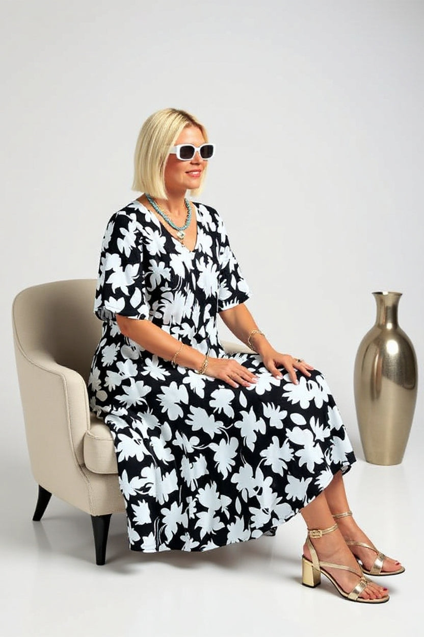 Elegant Patricia dress by The Rowan Daughters with flattering tummy coverage, shown in a stylish, fitted design.