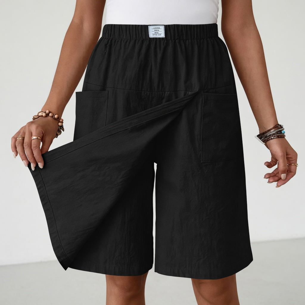 Black Maeve Wrap-Front Skort by Bennett and Family featuring a stylish wrap design and tailored fit for casual and chic looks.