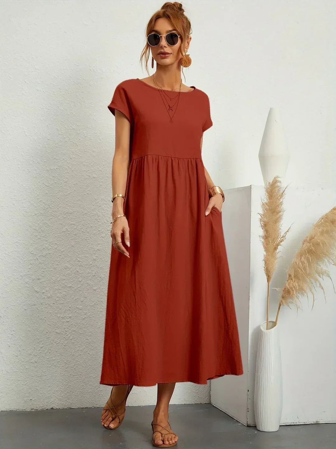 Flowing Gabrielle midi dress by Bennett and Family, featuring lightweight fabric and elegant design, displayed on a mannequin.
