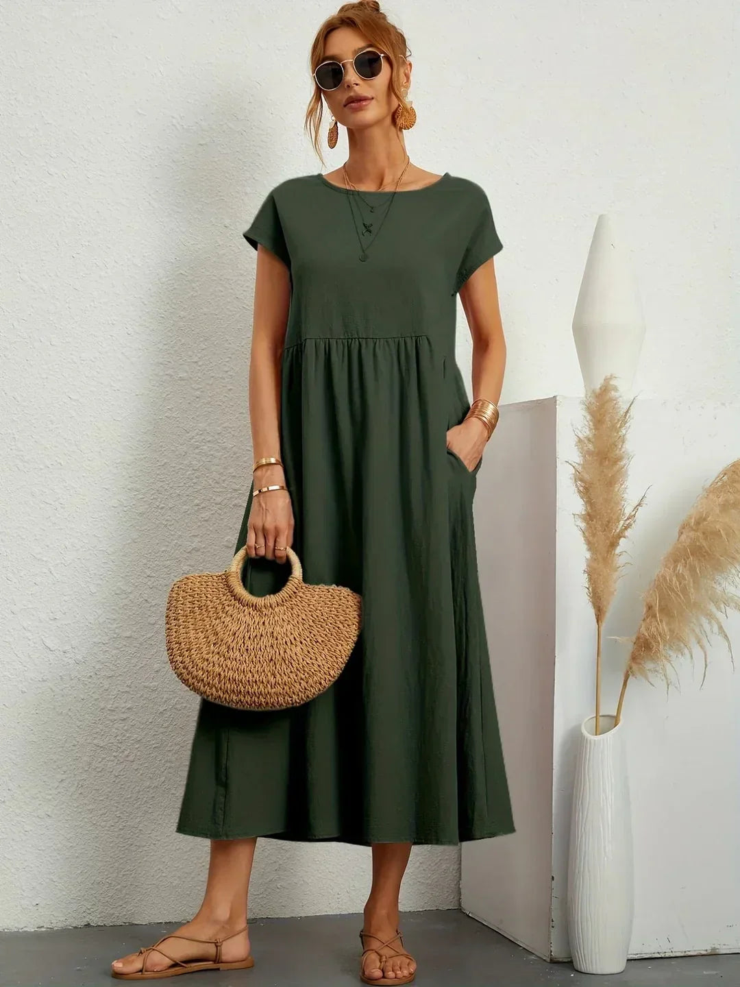 Flowing midi dress by Bennett and Family, featuring a lightweight fabric, elegant silhouette, and detailed neckline.
