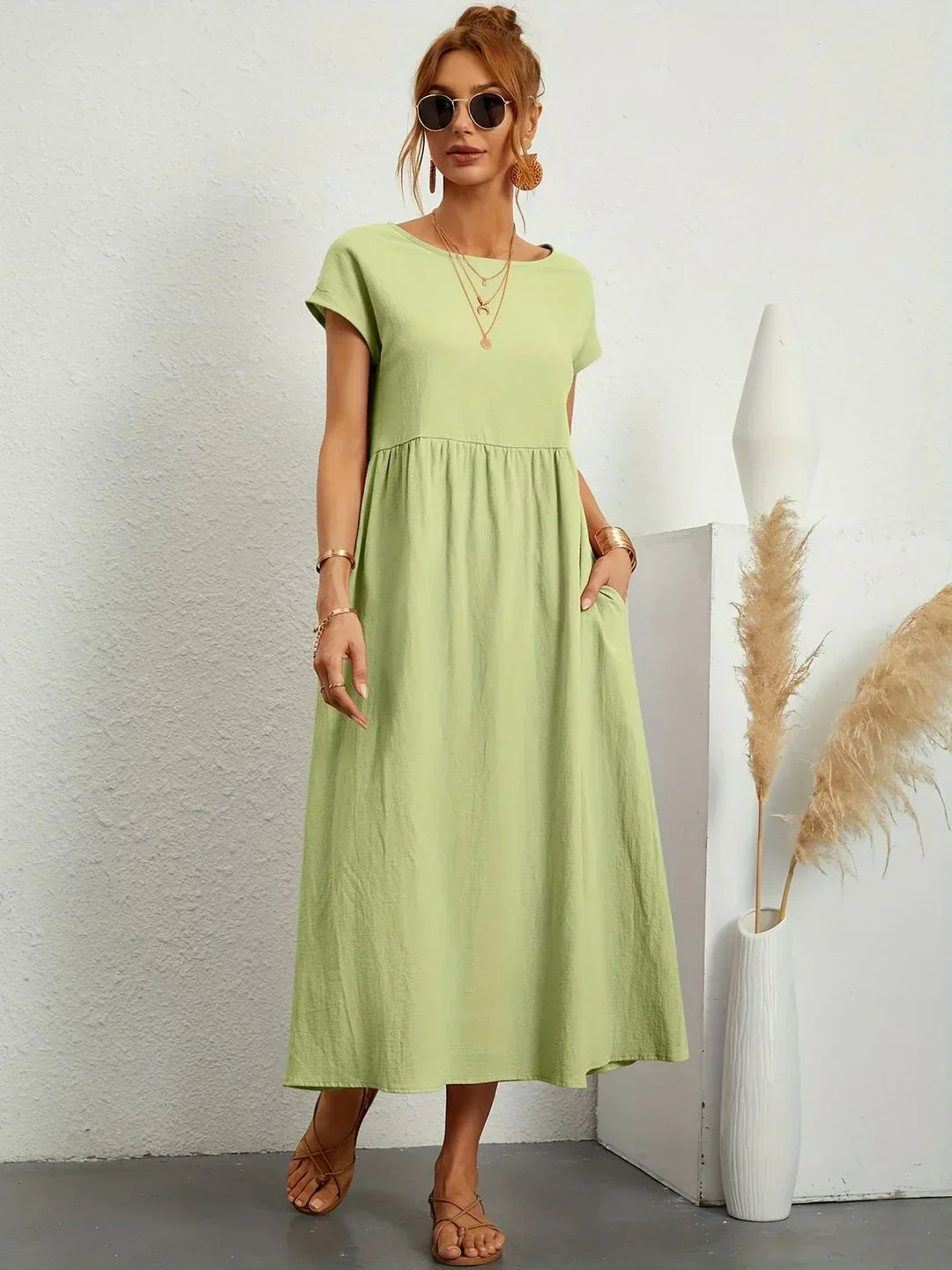 Flowing Gabrielle midi dress by Bennett and Family, soft fabric with a relaxed fit, displayed on a hanger.