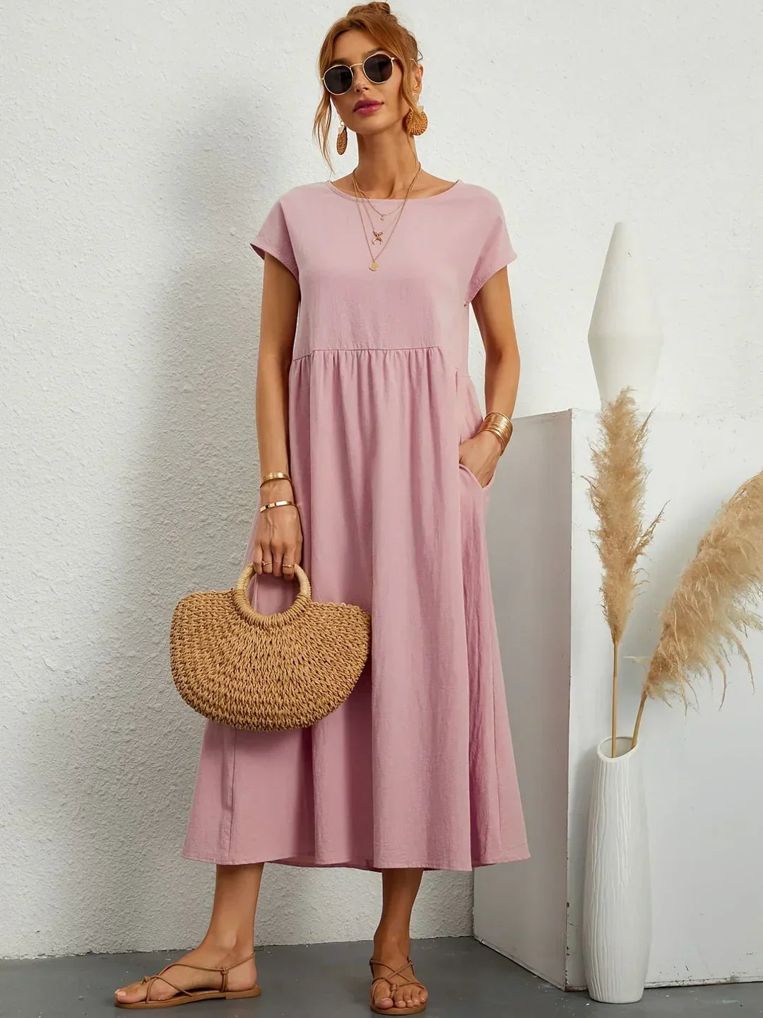 Flowing midi dress by Bennett and Family featuring soft fabric and a relaxed fit, shown in a stylish, natural pose.