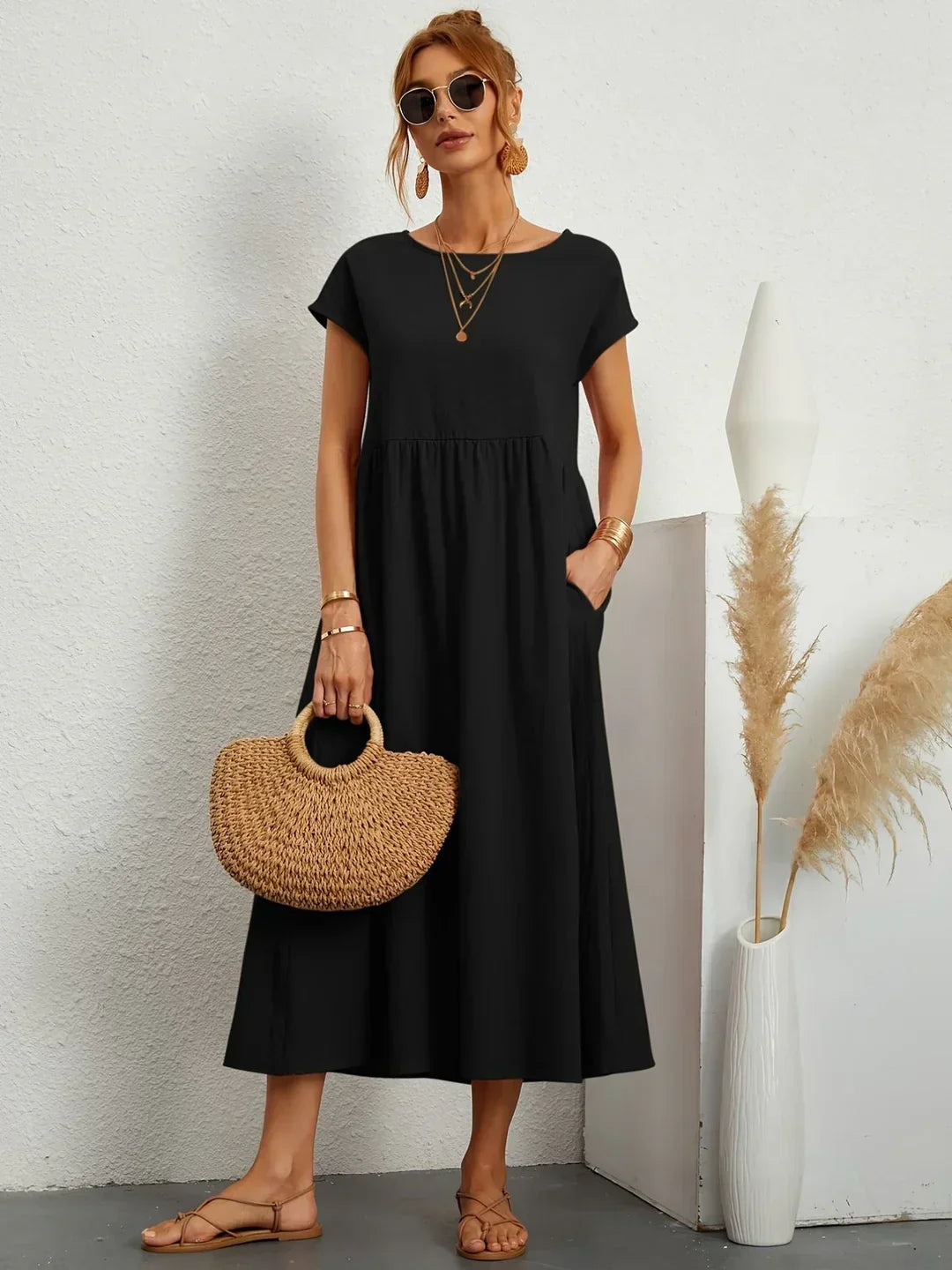 Flowing Gabrielle Midi Dress by Bennett and Family, shown in soft fabric with a relaxed fit and elegant design.