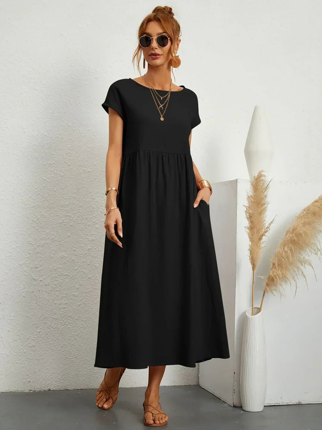 Flowing midi dress from Bennett and Family featuring a relaxed fit and elegant design, perfect for casual or semi-formal wear.