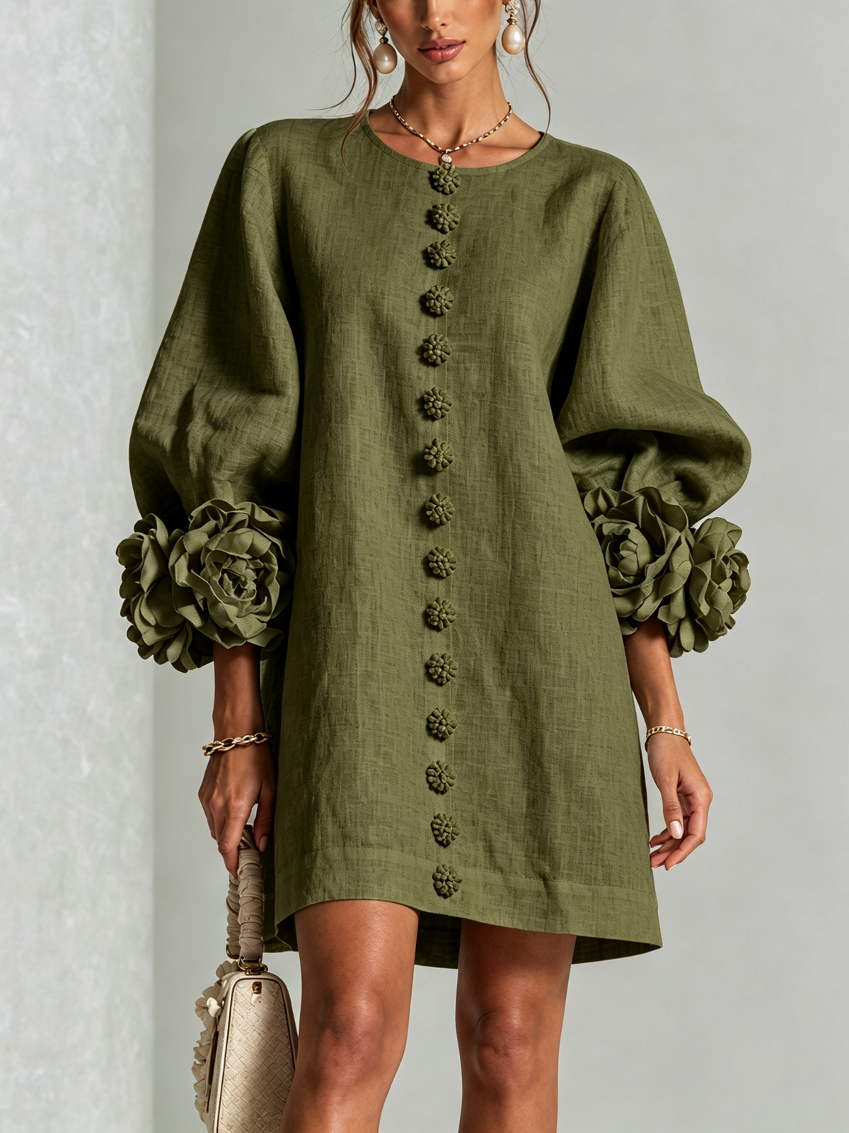Olive green Susanna Mini Dress by Bennett And Family, shown on a mannequin with a fitted silhouette and sleeveless design.