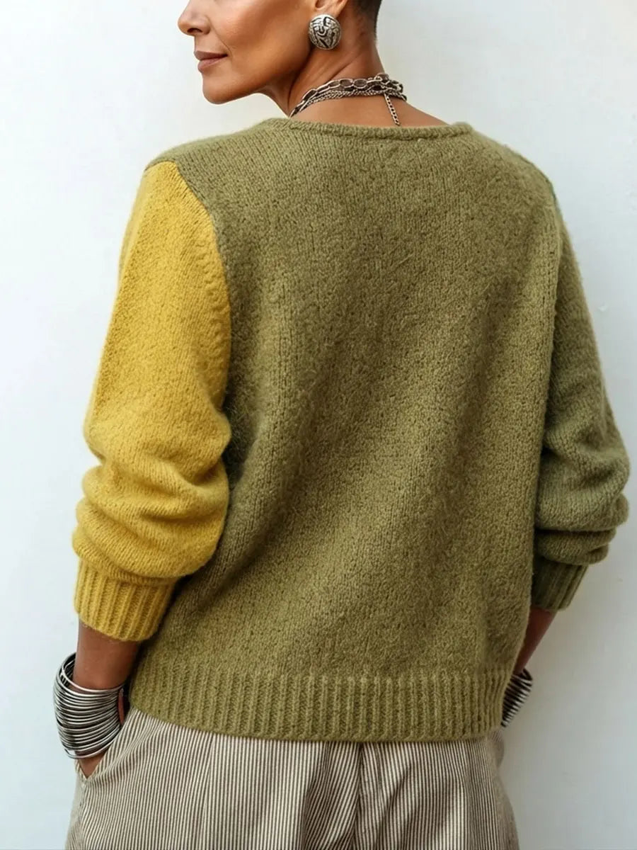 Bennett and Family Weston™ color-block knit sweater with vibrant blue, yellow, and gray sections, showcasing a cozy, stylish design.