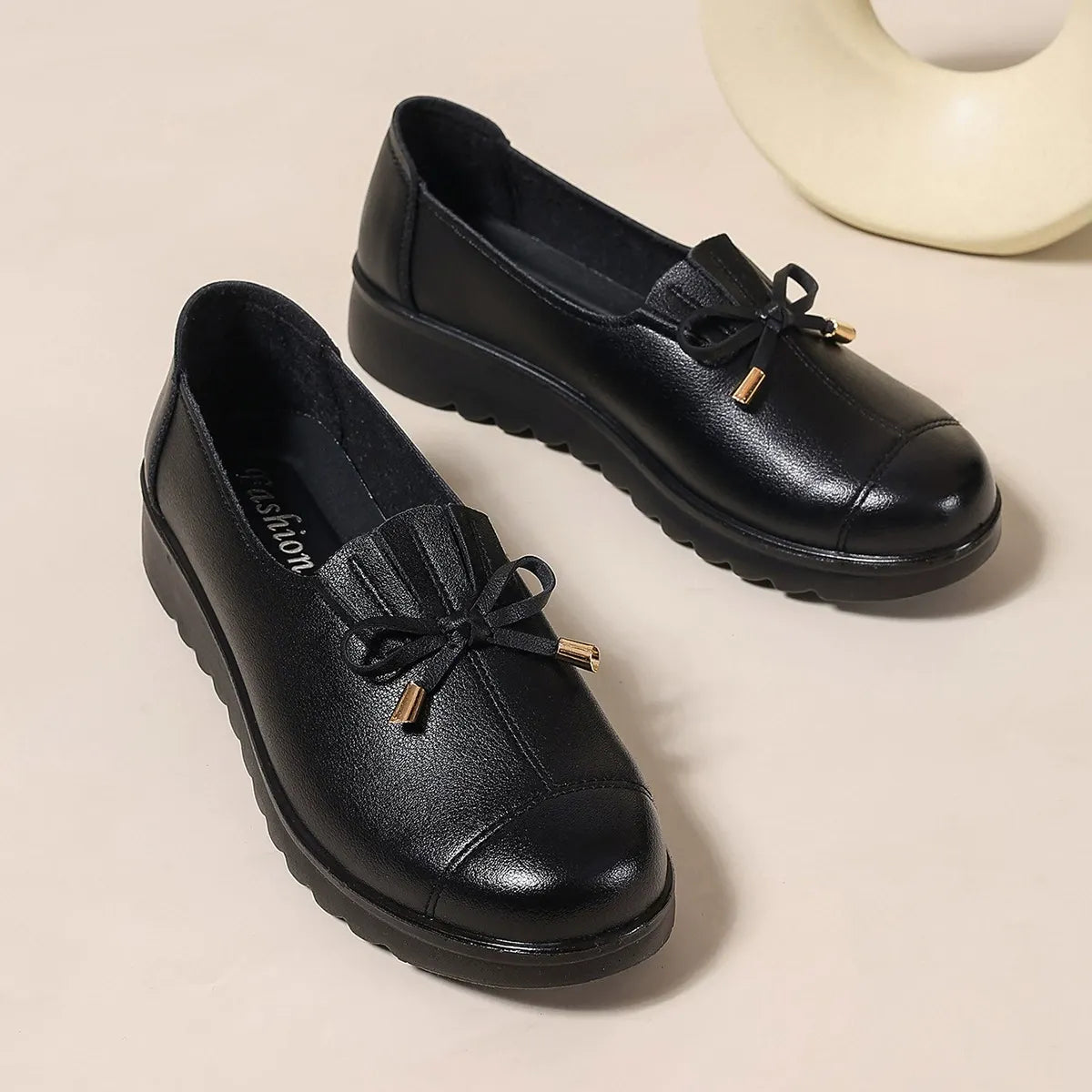 Catherine Bennett and Family Elegant Comfort loafers in black leather with a sleek, slip-on design for stylish comfort.
