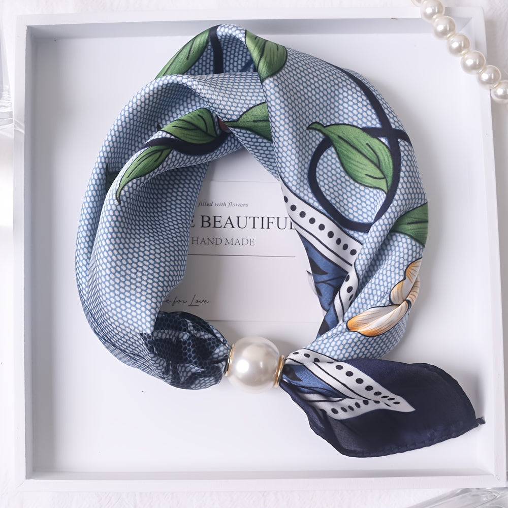 Elodie Bennett and Family scarf featuring soft, colorful fabric with floral and geometric patterns, stylishly draped.