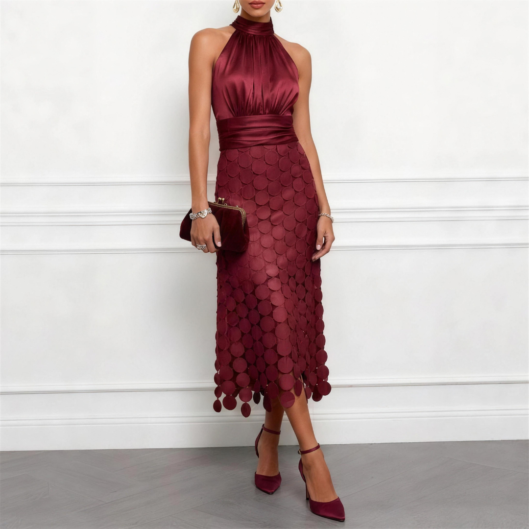 Bennett and Family Celine halter midi dress in flowing fabric with a fitted waist and elegant halter neckline.