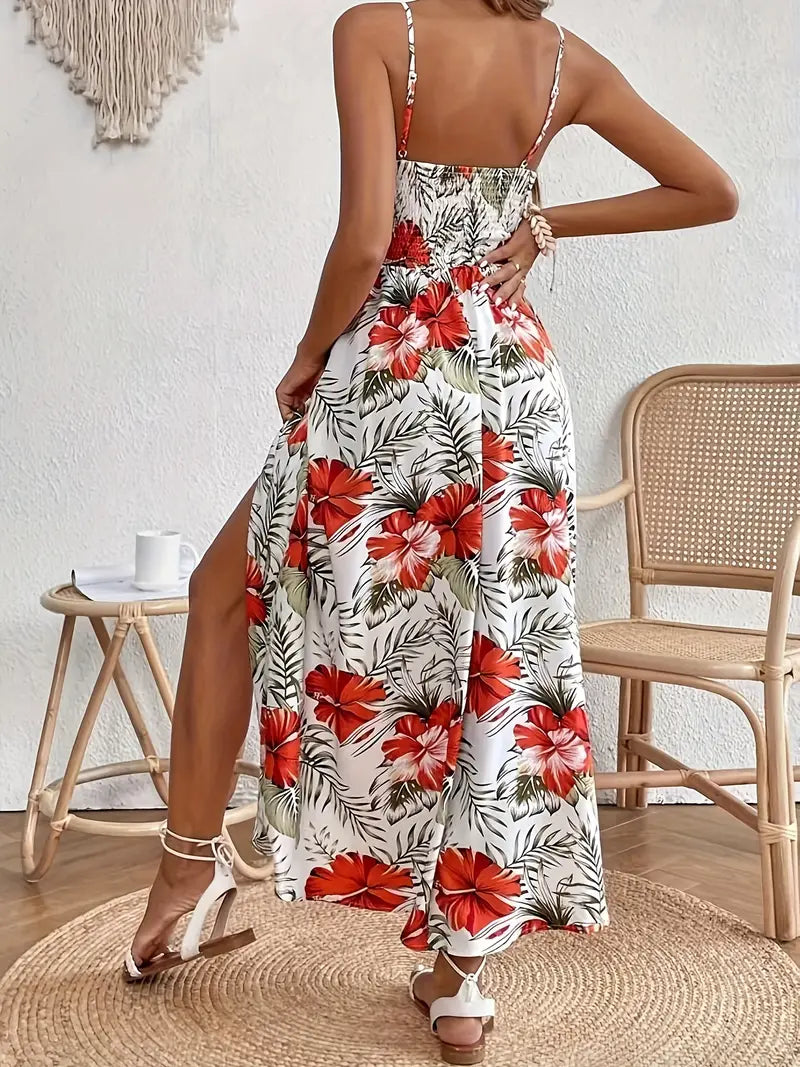 Ingrid summer dress by The Rowan Daughters featuring a vibrant floral print, sleeveless design, and flowing fabric.