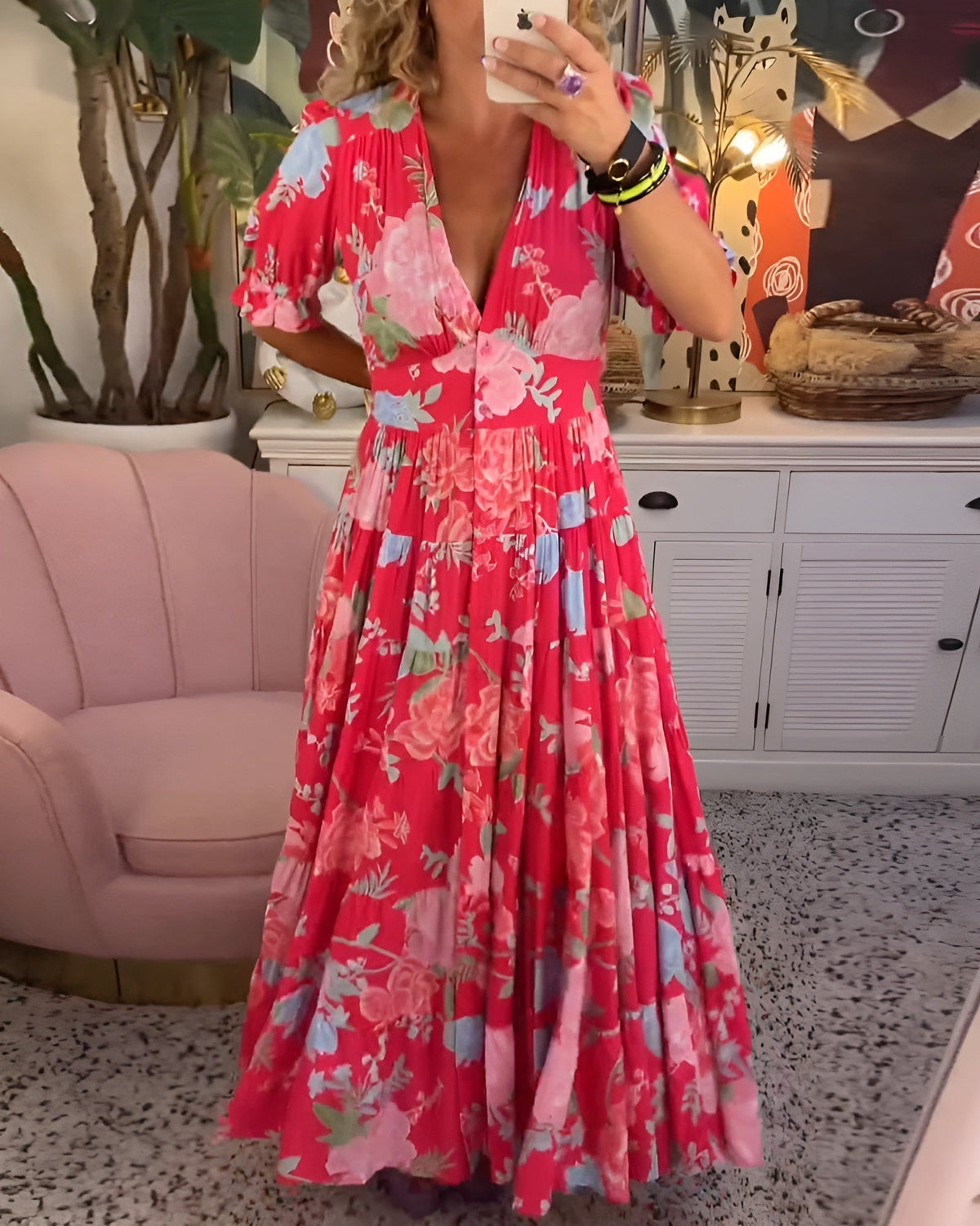 Carine floral print dress by The Rowan Daughters featuring pockets and a V-neck, shown on a model.