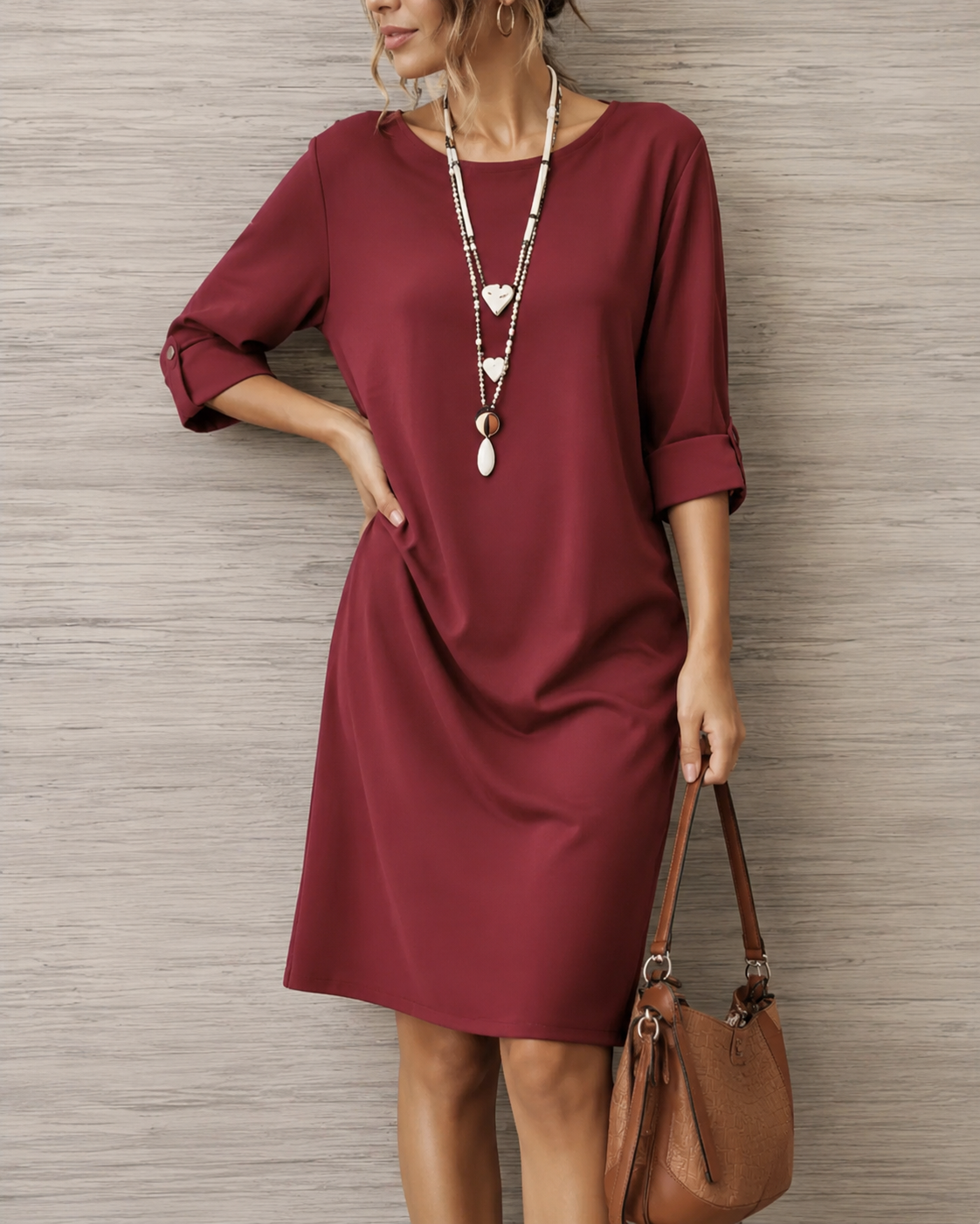 Odette midi dress by Bennett And Family, featuring a flowing fabric and elegant design, displayed on a hanger against a neutral background.