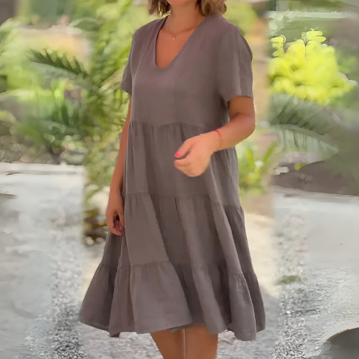 Light gray loose dress with V-neck by The Rowan Daughters, shown on a model with a relaxed fit and flowing fabric.