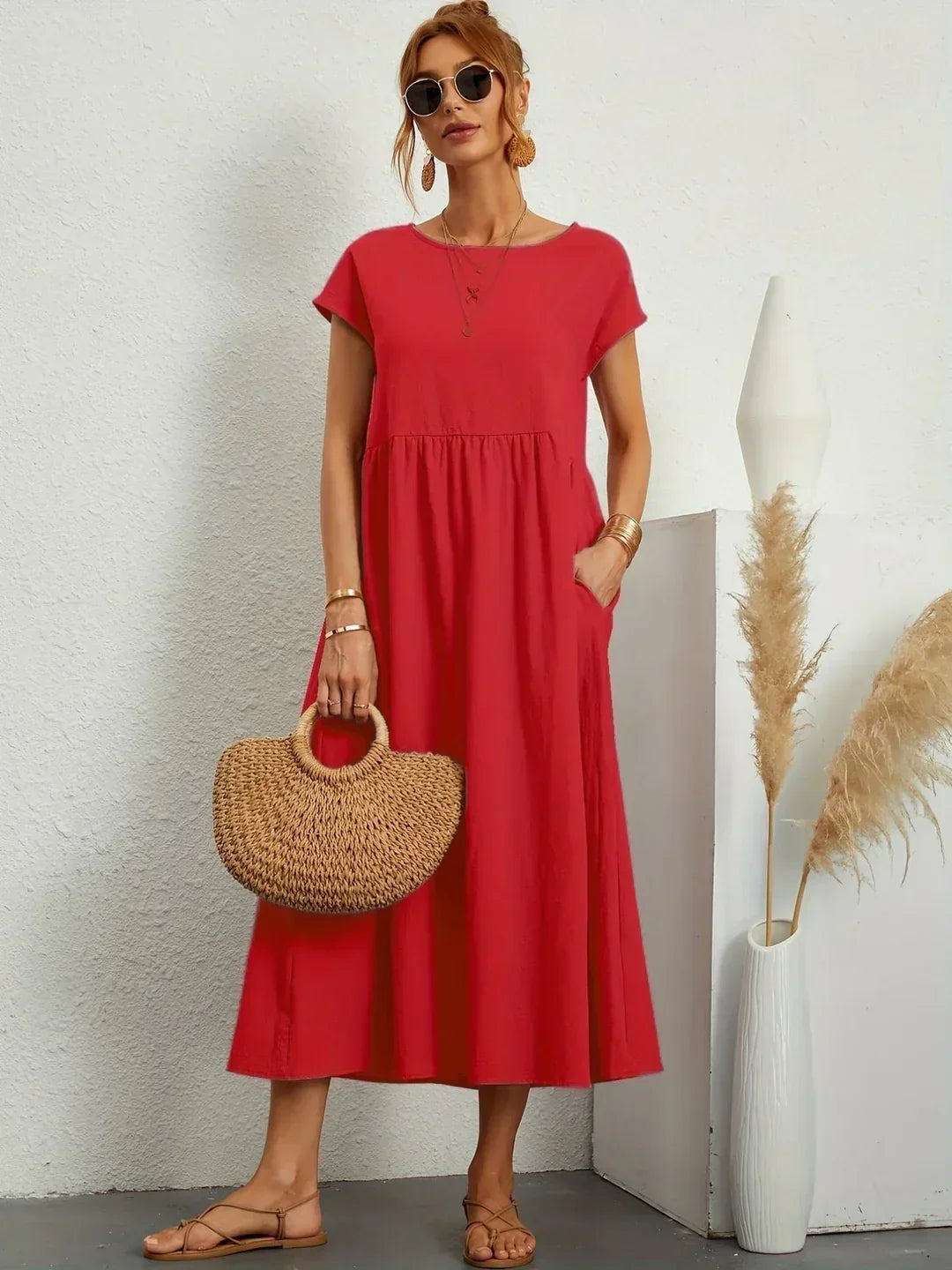 Flowing midi dress by Bennett and Family featuring a relaxed fit, soft fabric, and elegant design, showcased in the image.