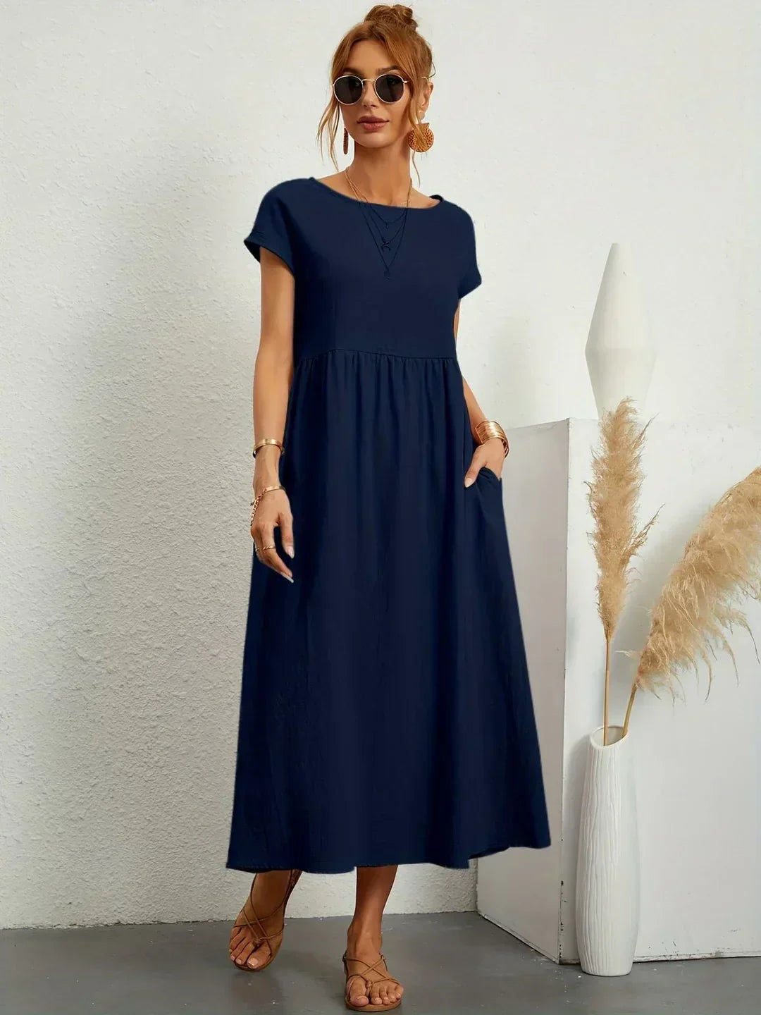 Flowing midi dress by Bennett and Family featuring a relaxed fit and elegant design, shown on a model.