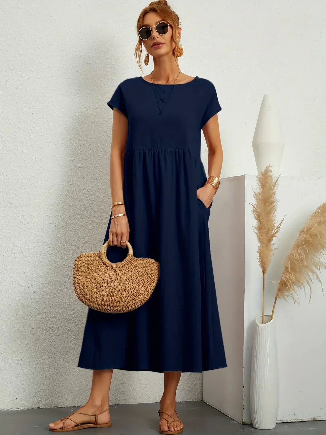 Flowing midi dress by Bennett and Family featuring a relaxed fit and elegant design, shown in soft fabric with a flowing silhouette.