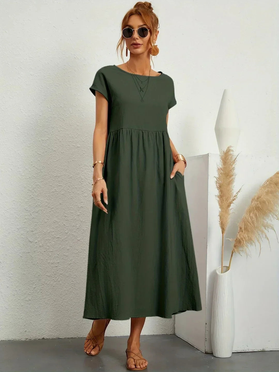 Flowing midi dress by Bennett and Family, featuring a relaxed fit and elegant design, shown in a lightweight fabric.