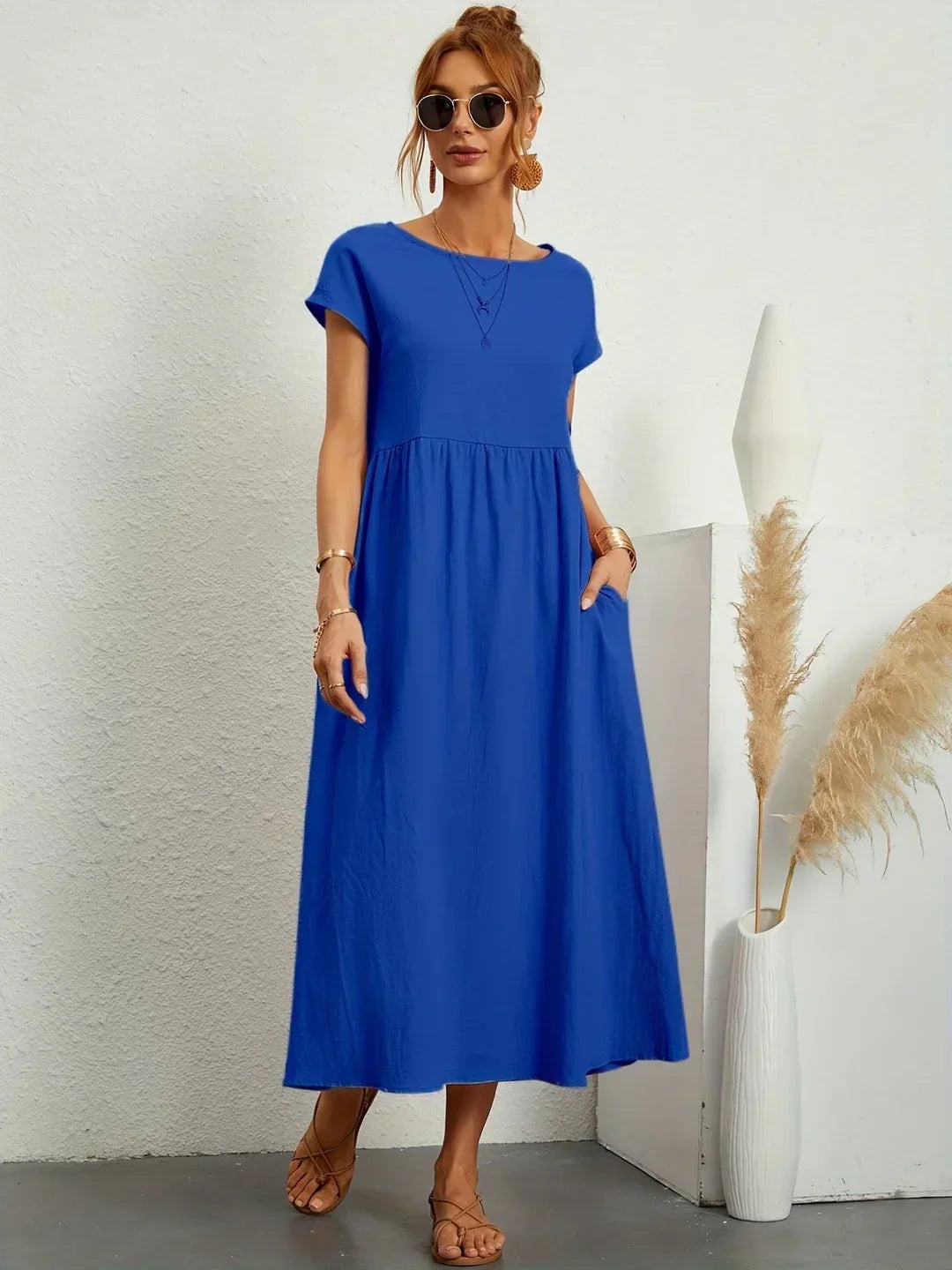 Flowing midi dress by Bennett and Family featuring a relaxed fit and elegant design, shown on a model in a stylish setting.