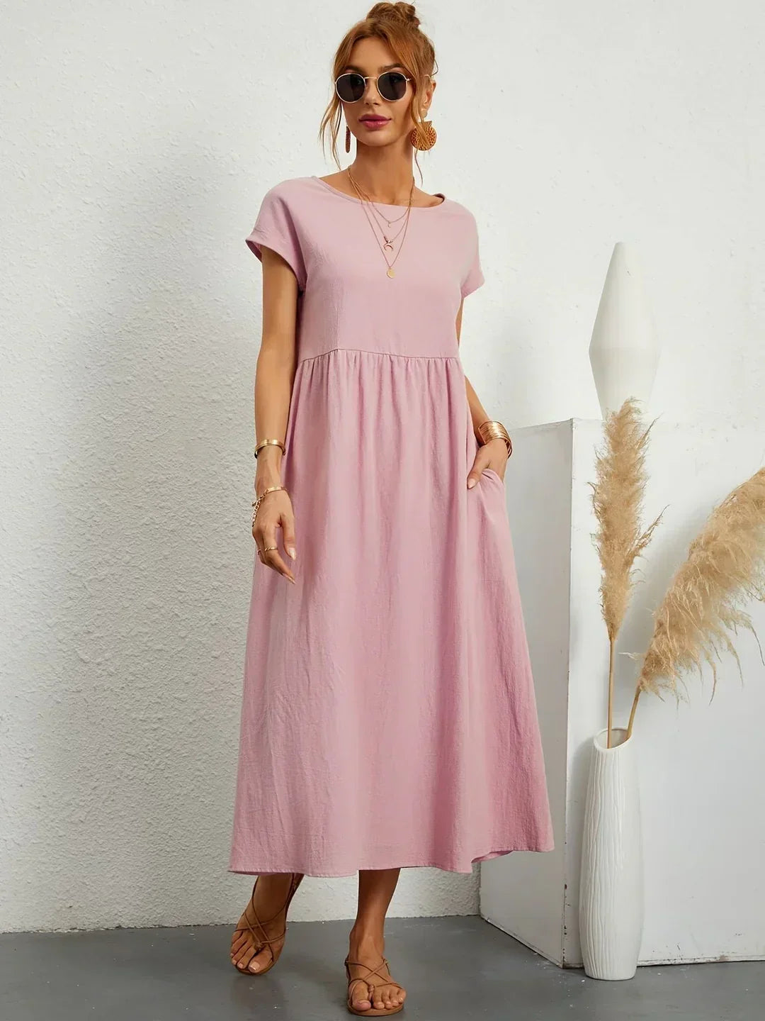 Flowing midi dress by Bennett and Family with a relaxed fit, featuring a smooth fabric and elegant design.