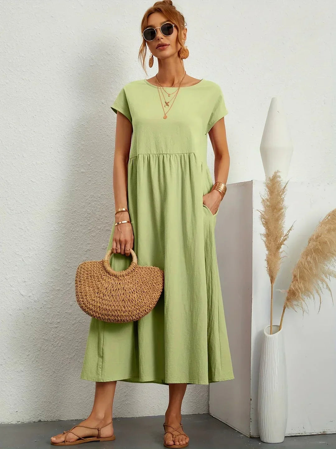 Flowing midi dress by Bennett and Family featuring a graceful silhouette and elegant fabric, perfect for stylish occasions.