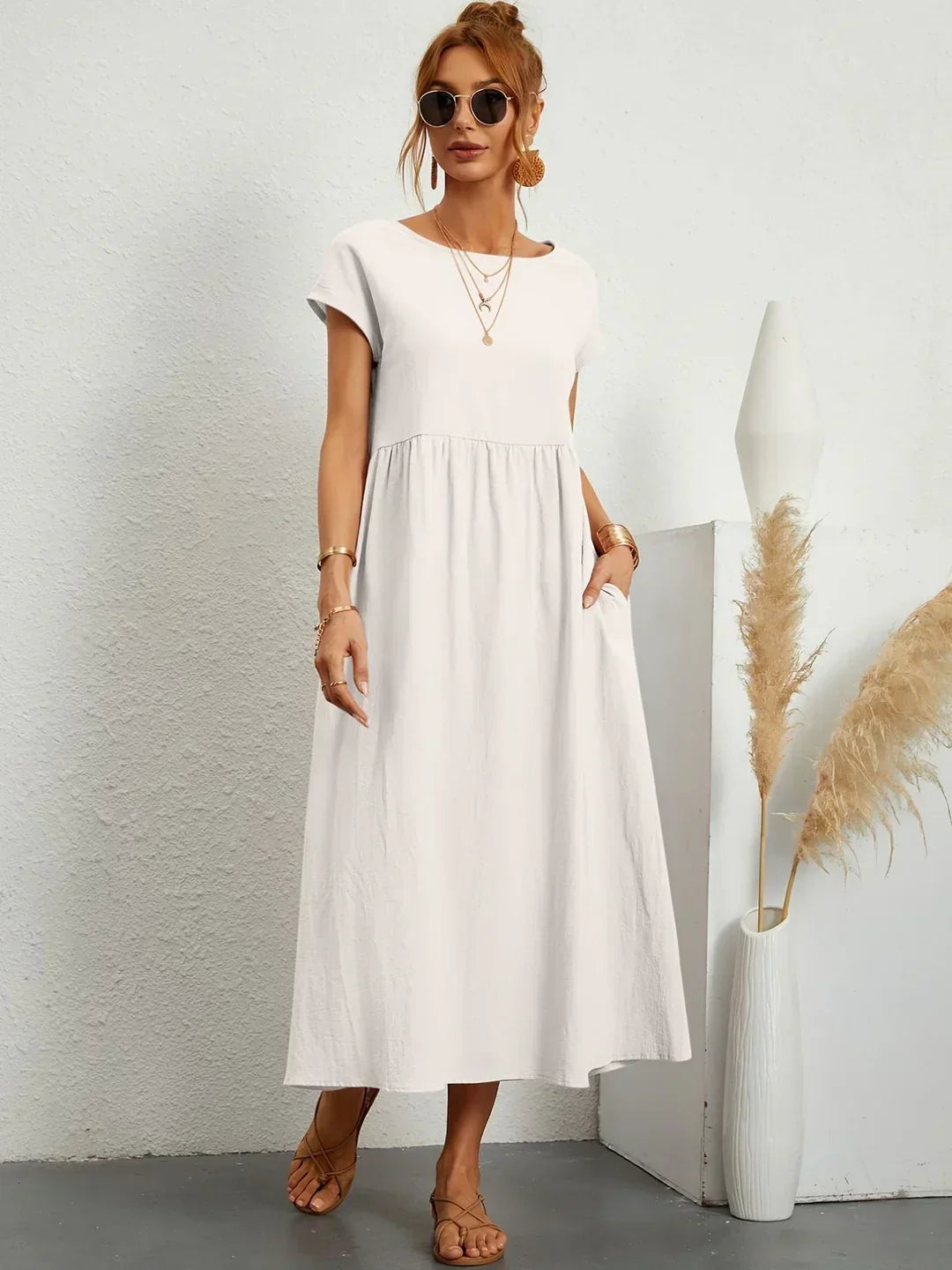 Flowing midi dress by Bennett and Family featuring a relaxed fit and elegant design, shown in a soft, flowing fabric.