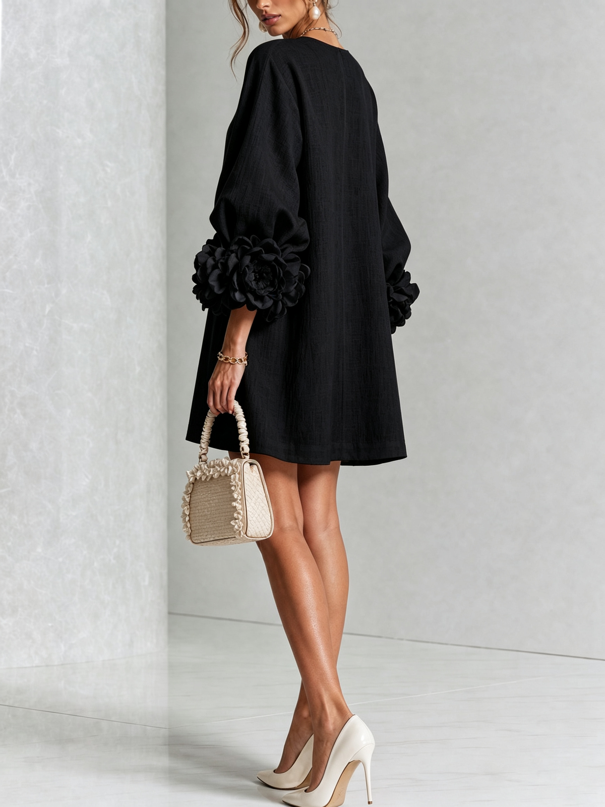 Black Susanna Mini Dress by Bennett And Family with a fitted silhouette and stylish design, displayed on a model.