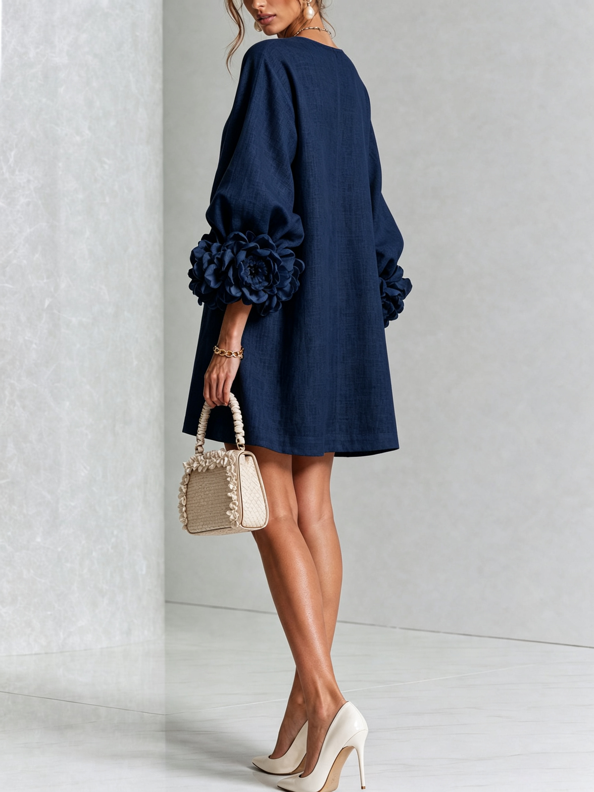 Navy Susanna mini dress by Bennett and Family featuring a fitted silhouette and short sleeves, shown on a model.