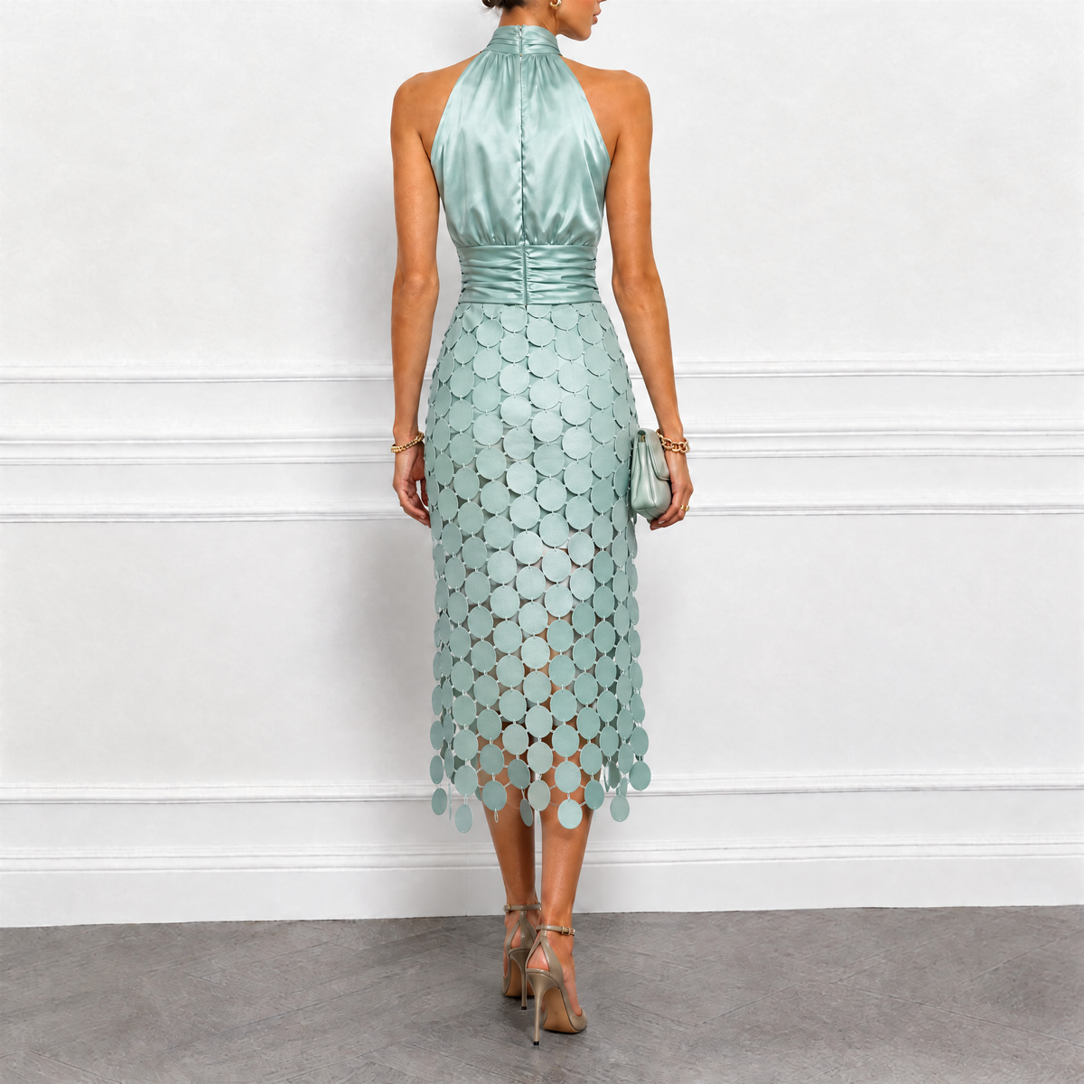 Bennett and Family Celine halter midi dress in flowing fabric, featuring a fitted bodice and elegant length, displayed on a hanger.